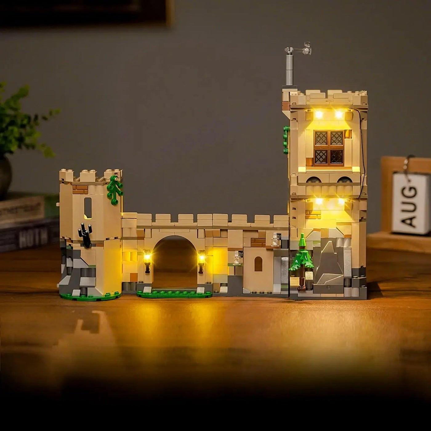LEGO® Harry Potter Hogwarts Castle: Flying Lessons #76447 fully illuminated on display, with the display light kit