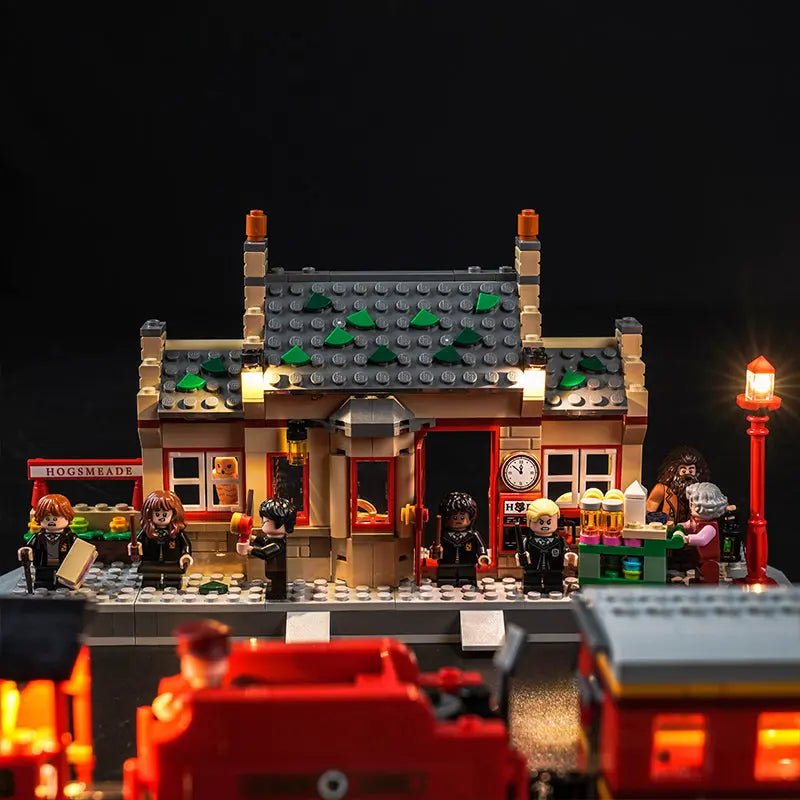 LEGO® Harry Potter Hogwarts Express & Hogsmeade Station #76423 — front view fully lit (premium LED light kit)