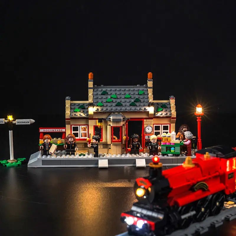 LEGO Harry Potter Hogwarts Express & Hogsmeade Station #76423 illuminated at night