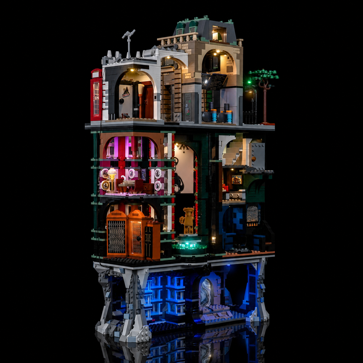 Angled view of the lit LEGO Ministry of Magic 76476 showing the pink office, the lift doors and the blue basement