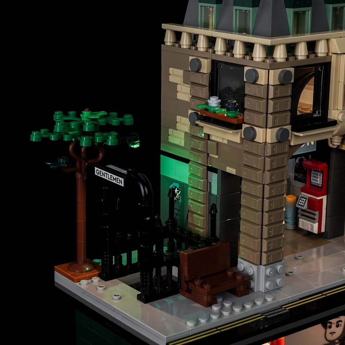 Street level of LEGO Ministry of Magic 76476: the Gentlemen entrance and the staircase lit green