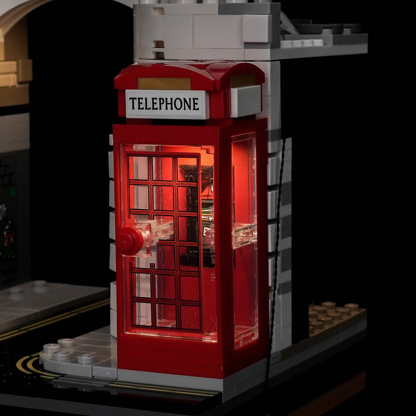 Close-up of the red telephone box on LEGO Ministry of Magic 76476, lit from the inside