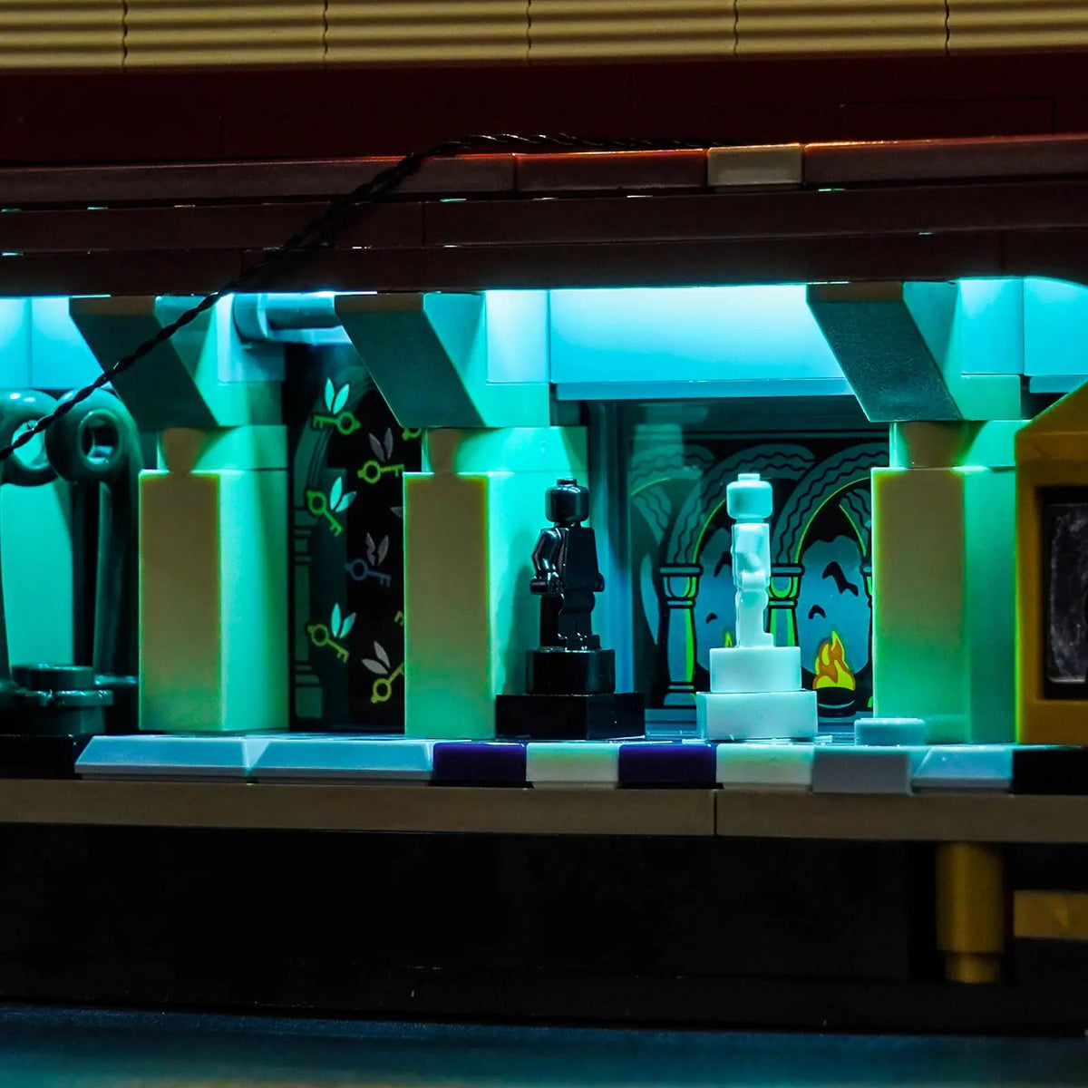 LEGO® Harry Potter Sorcerer's Stone #76466 fully illuminated on display, with the LED lighting kit