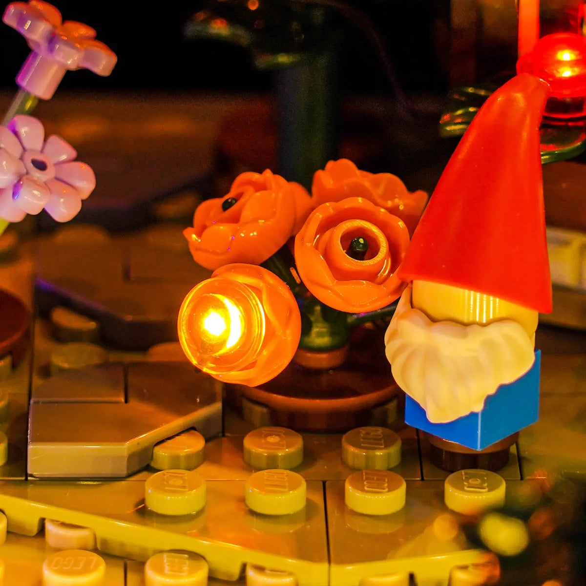 LEGO® Icons Autumn Cottage Garden #11372 installed and glowing, with the light kit