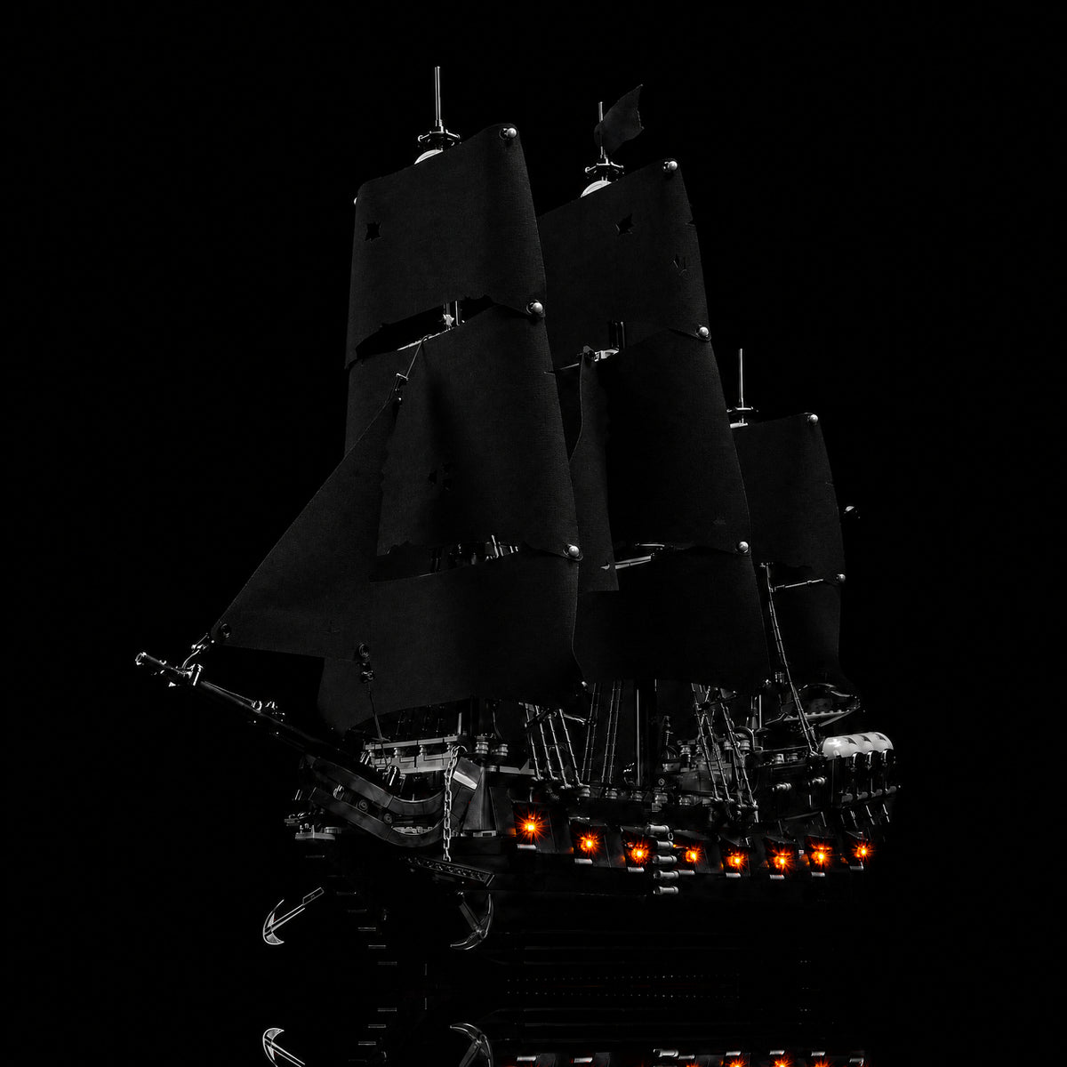 LEGO® Icons Captain Jack Sparrow's Pirate Ship #10365 — side angle with lights on (LED lighting kit)