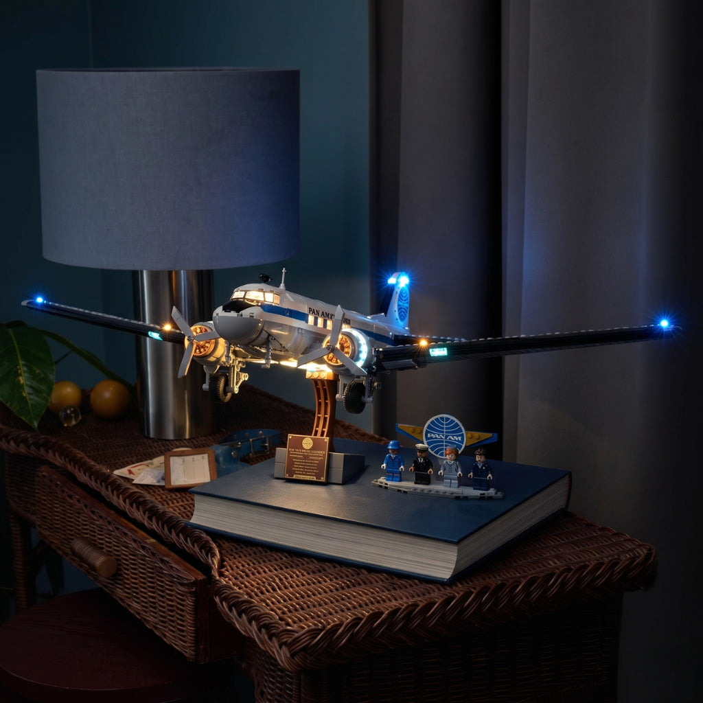LEGO® Icons Douglas DC-3 PAN AM Airliner #11378 side angle with lights on, with the LED lights