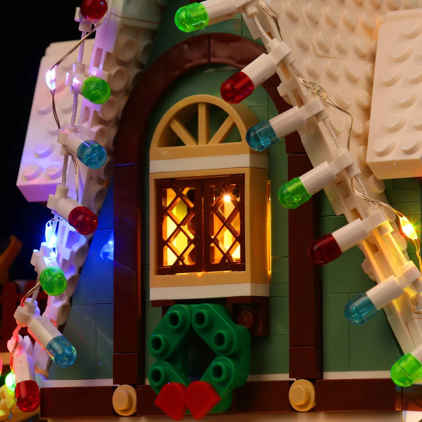 LEGO® Icons Elf Club House #10275 — side angle with lights on (custom LED lighting)