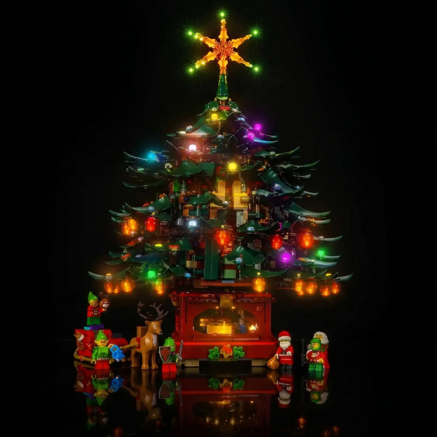 LEGO® Icons Family Christmas Tree #41843 fully illuminated on display, with the LED lighting kit