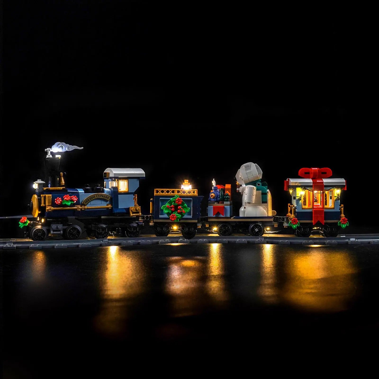 LEGO Icons Holiday Express Train #10361 illuminated at night