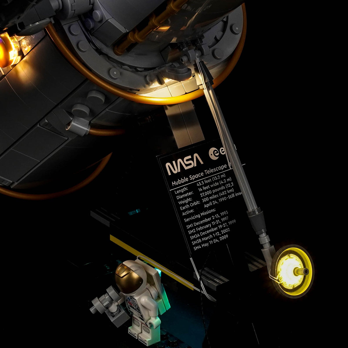 LEGO® Icons Hubble Space Telescope #11382 display lighting in a dark room, with the premium LED light kit