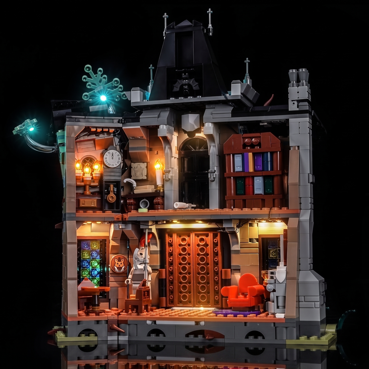 LEGO® Icons Mayor Manor #11383 the manor lit in a dark room, with the USB-powered LED light kit