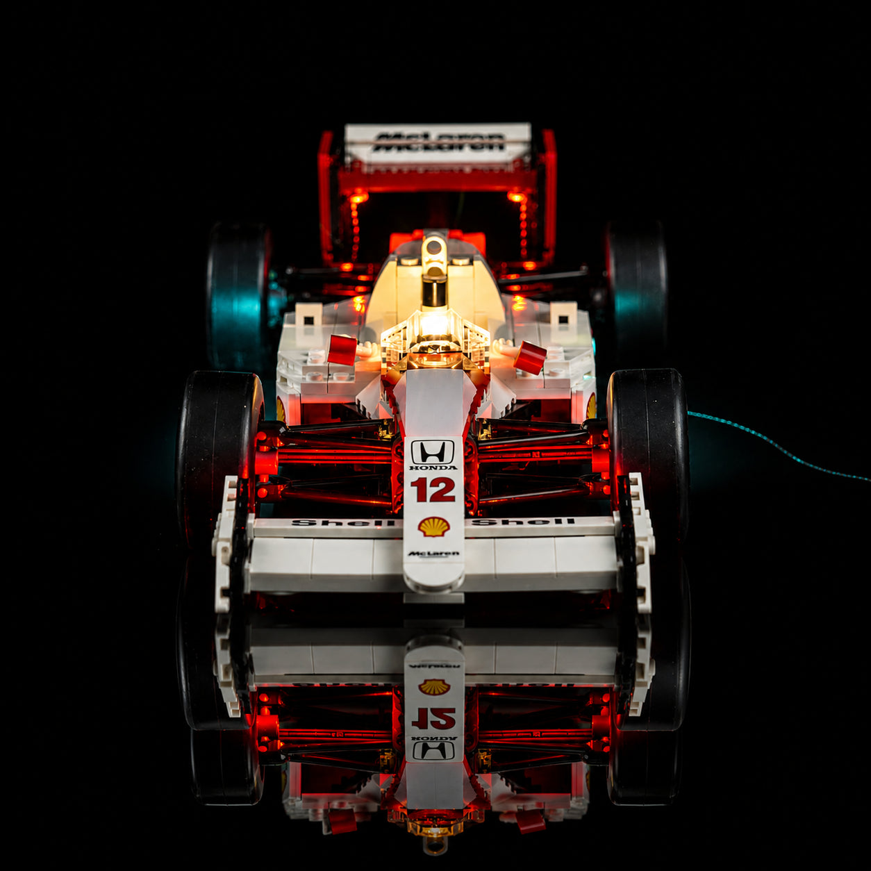 DIY LED light kit for LEGO® Icons McLaren MP4/4 & Ayrton Senna #10330, fully illuminated on display