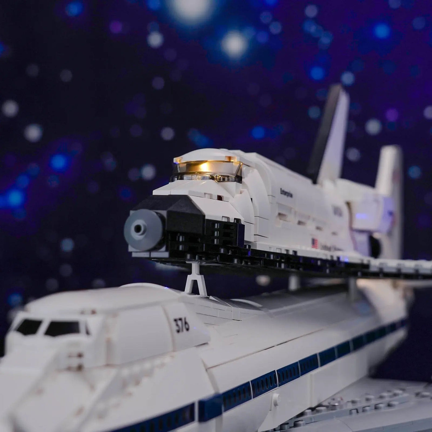 LEGO® Icons Shuttle Carrier Aircraft #10360 illuminated at night, with the premium LED light kit