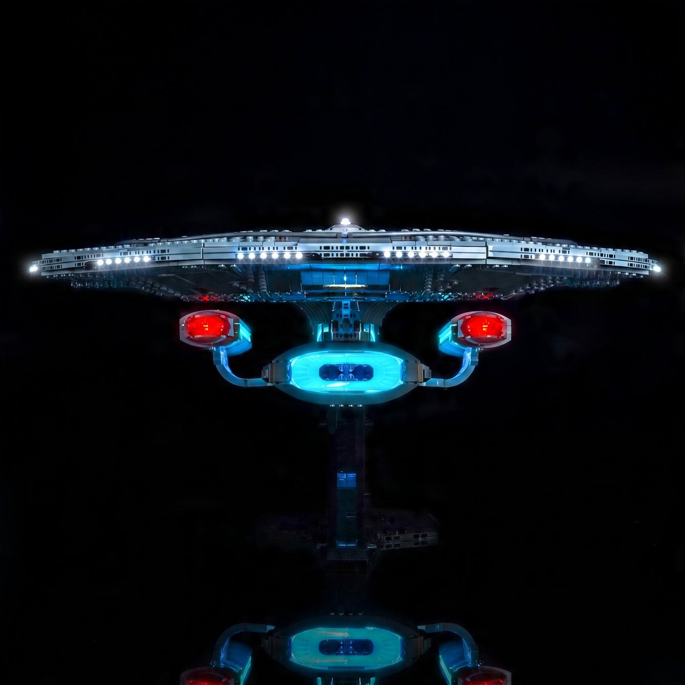 LEGO® Icons Star Trek U.S.S. Enterprise NCC-1701-D #10356 display lighting in a dark room, with the premium LED light kit