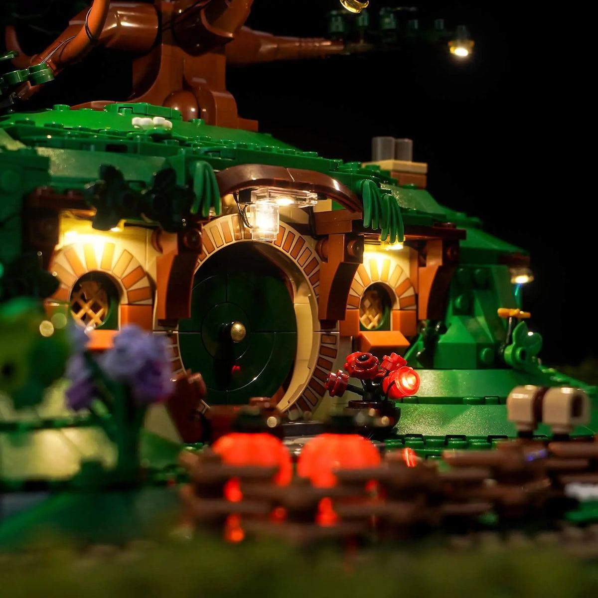 LEGO® Icons The Lord of the Rings: The Shire #10354 — side angle with lights on (LED lighting kit)