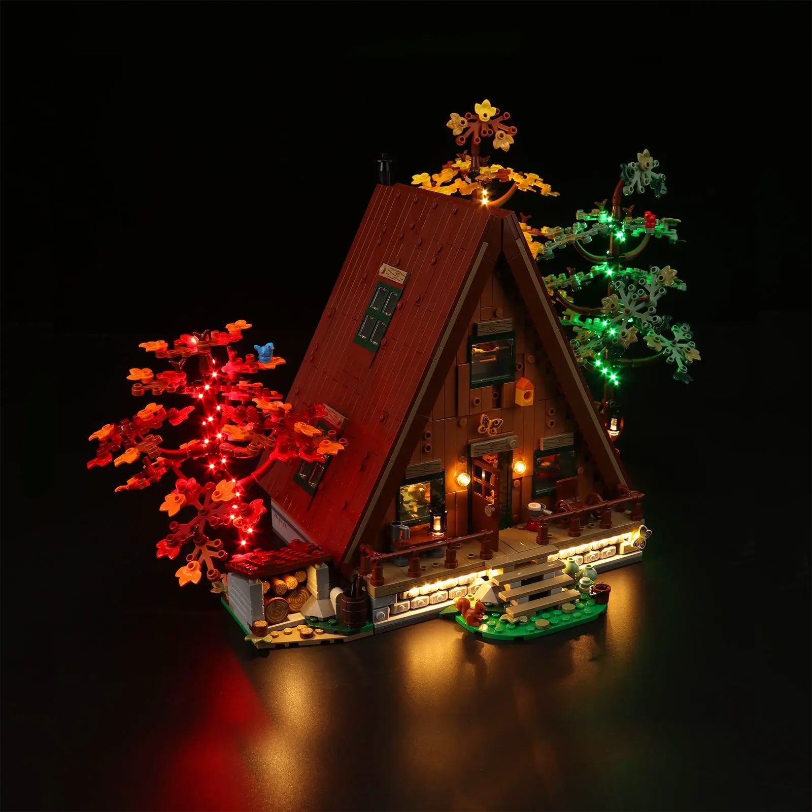LEGO Ideas A-Frame Cabin #21338 illuminated at night