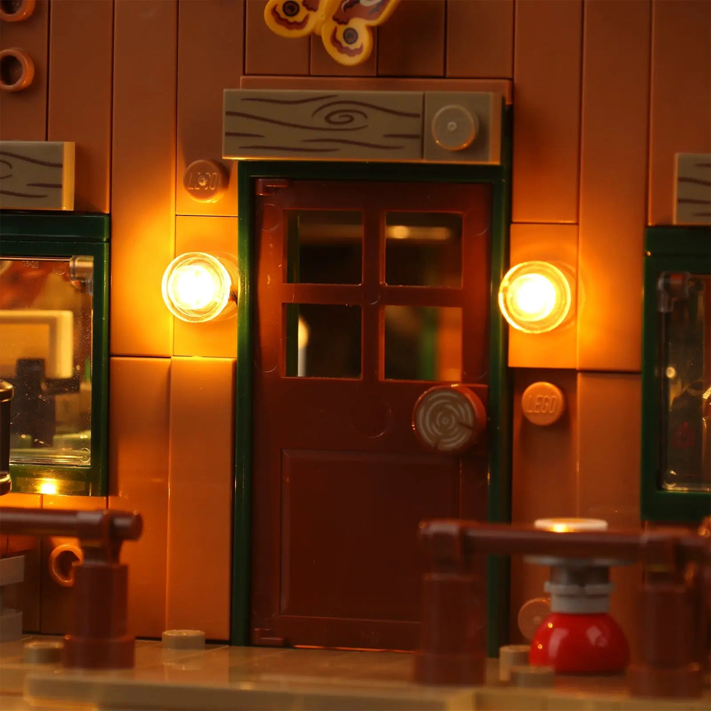 LEGO® Ideas A-Frame Cabin #21338 installed and glowing, with the LED lights