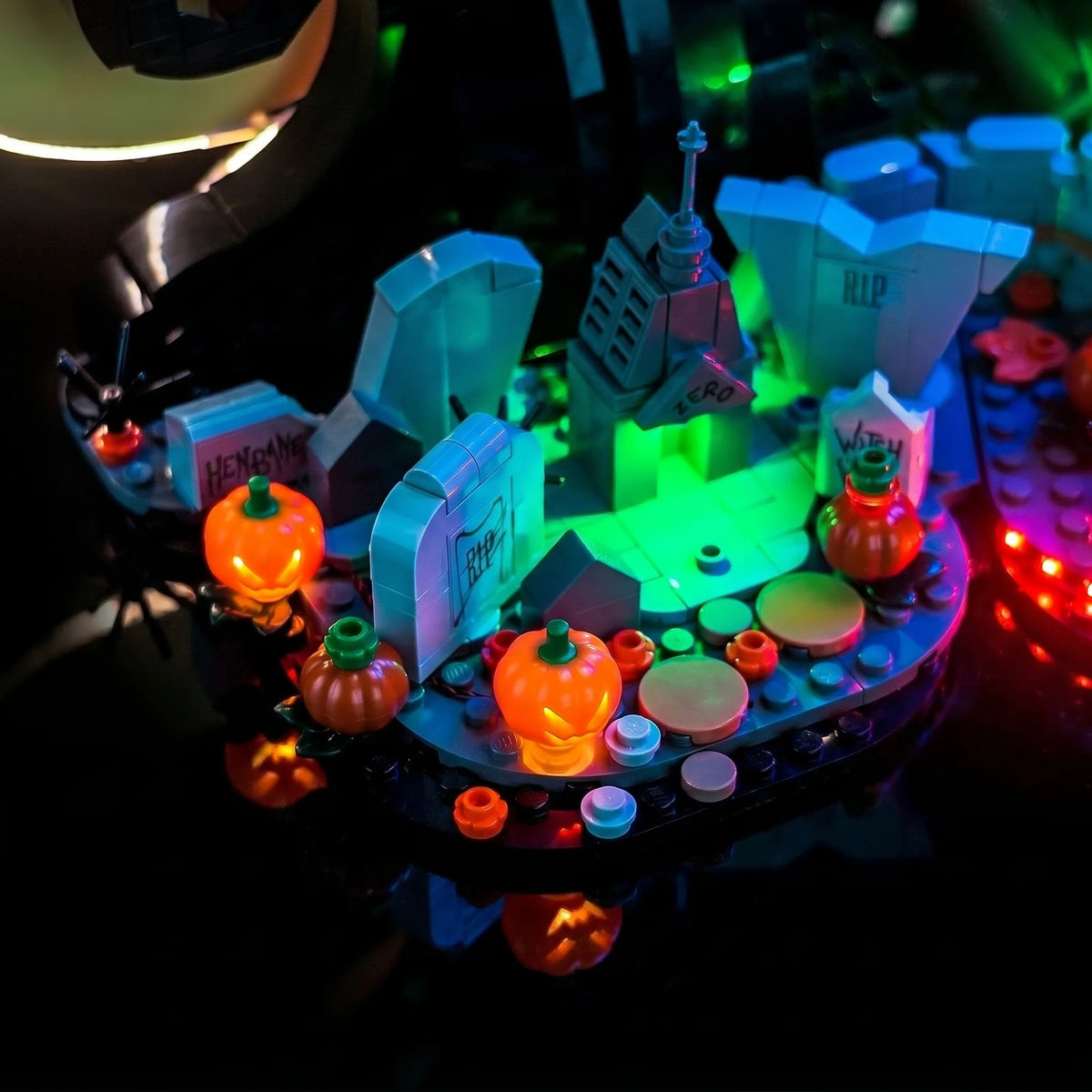 LEGO® Ideas Disney Tim Burton's The Nightmare Before Christmas #21351 showcase lighting view, with the display light kit