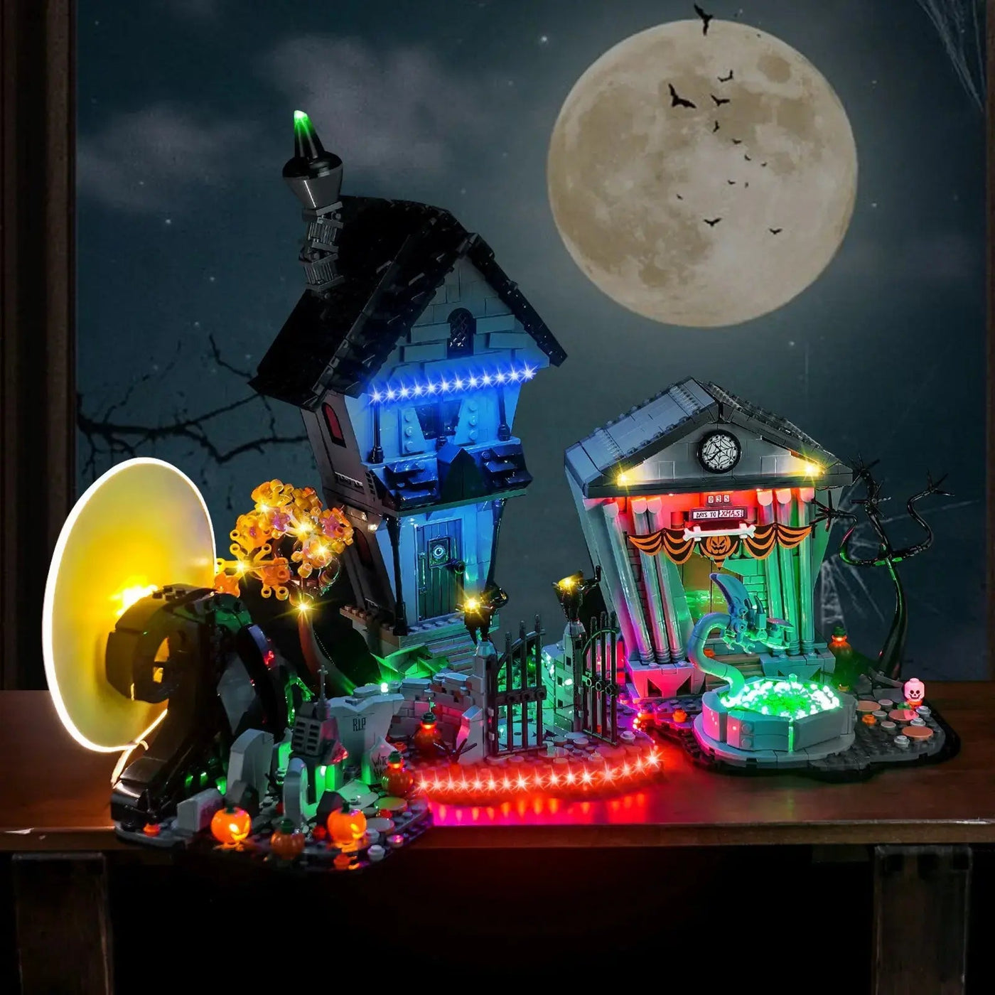 LEGO® Ideas Disney Tim Burton's The Nightmare Before Christmas #21351 illuminated at night, with the premium LED light kit