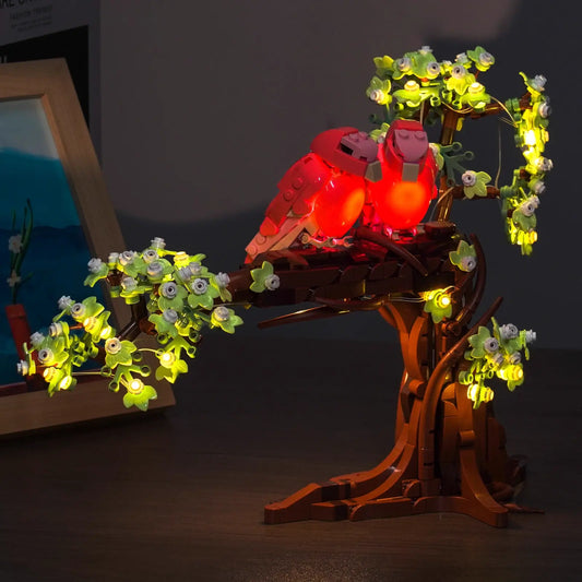 LEGO® Ideas Love Birds #21365 display lighting in a dark room, with the LED lights