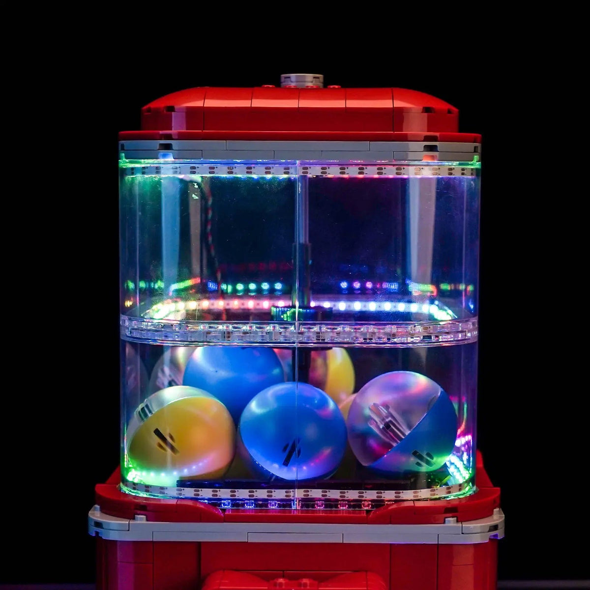 LEGO® Ideas Minifigure Vending Machine #21358 illuminated at night, with the light kit