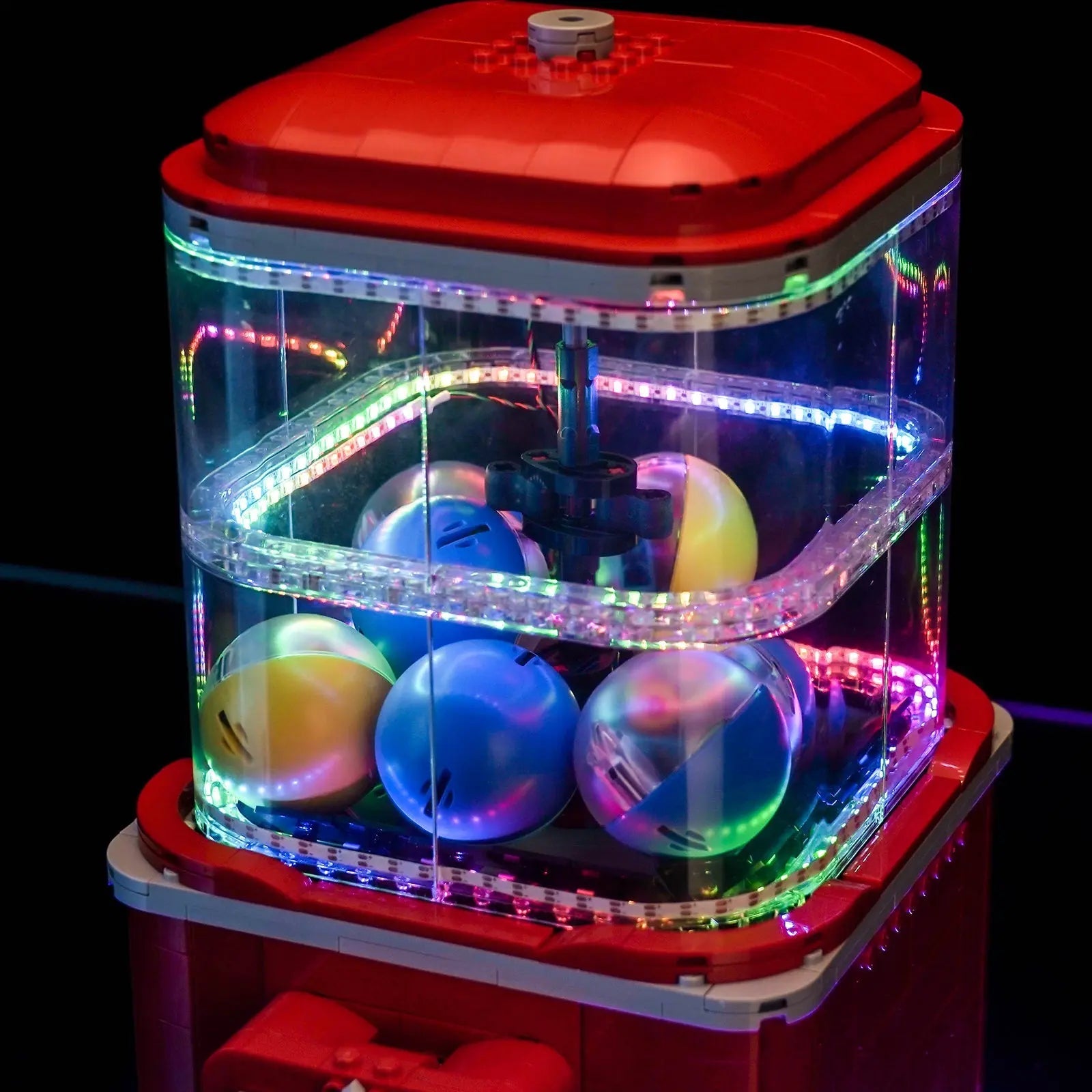 LEGO Ideas Minifigure Vending Machine #21358 illuminated at night