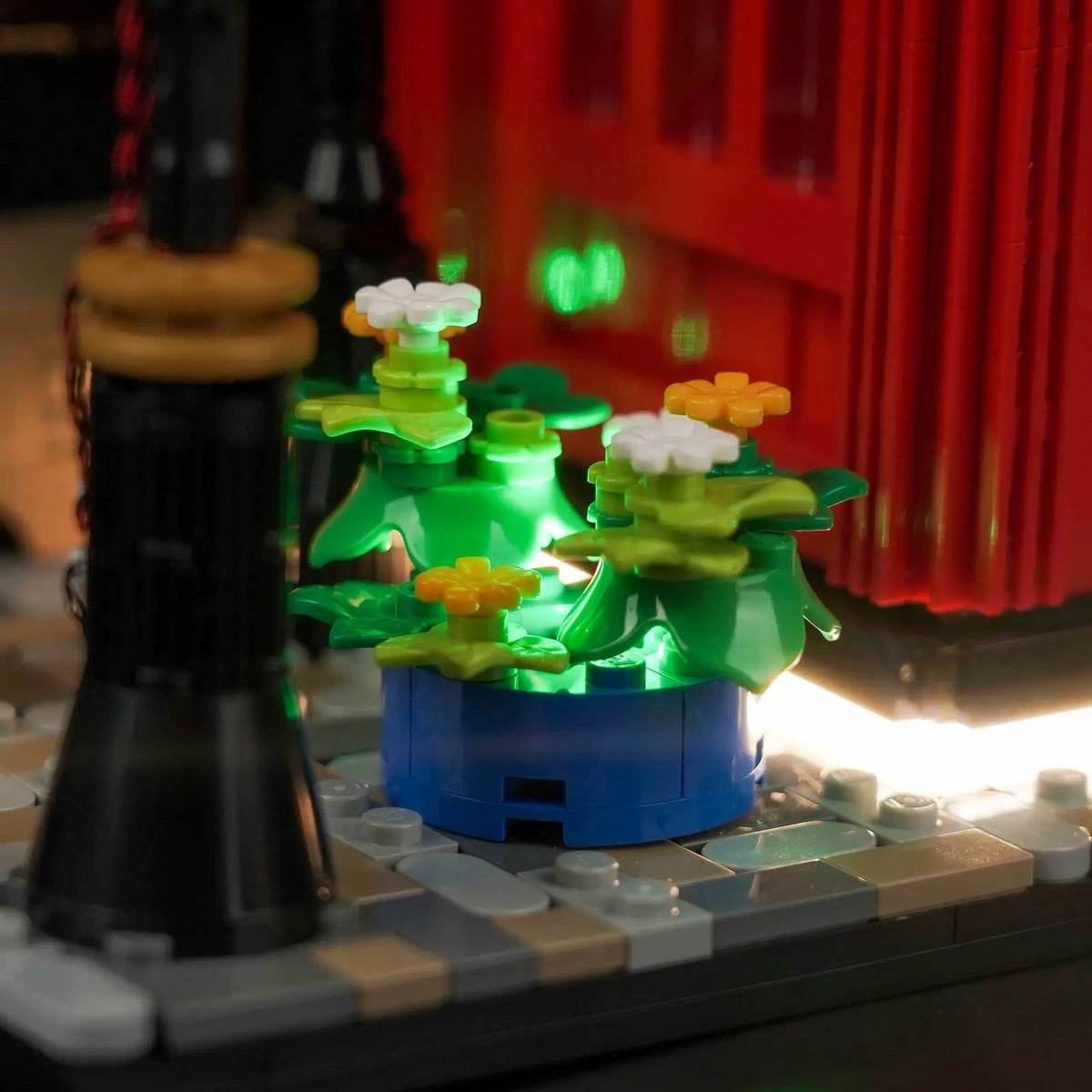 LEGO® Ideas Red London Telephone Box #21347 installed and glowing, with the LED lighting kit