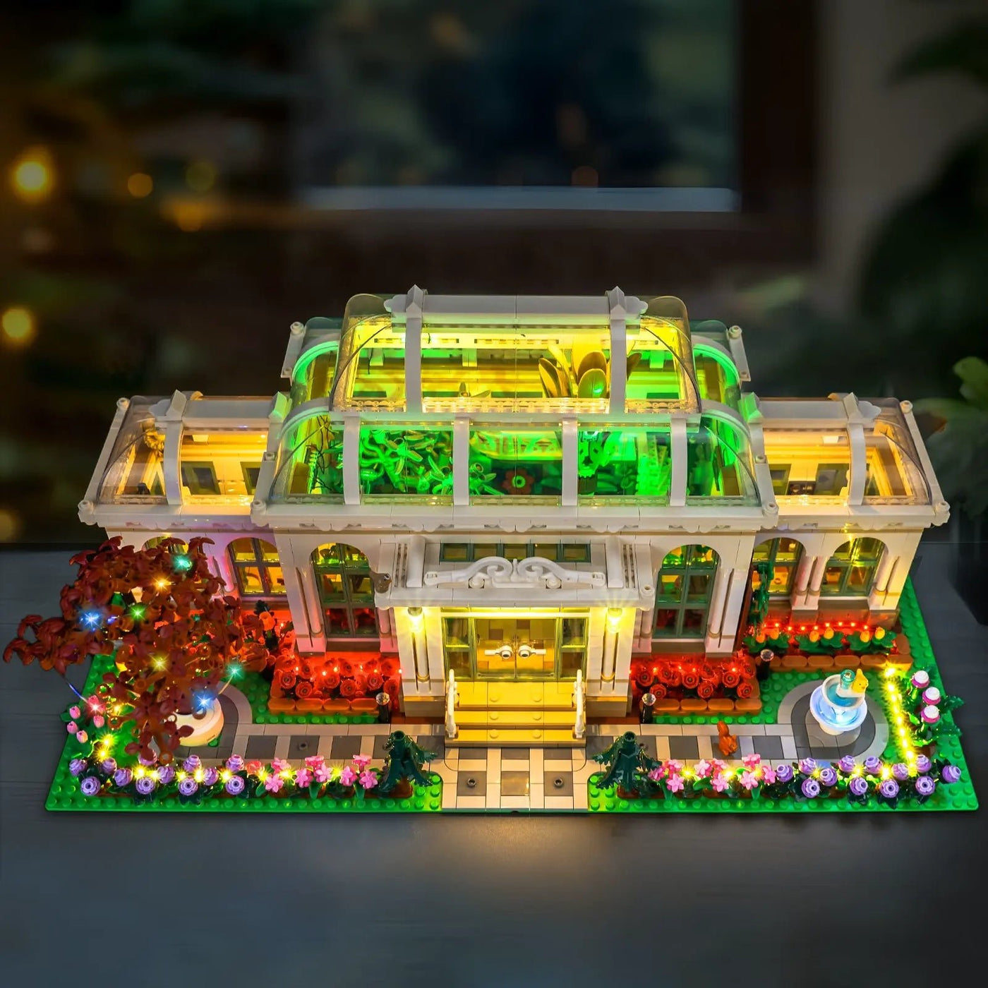 LEGO® Ideas The Botanical Garden #21353 installed and glowing, with the display light kit
