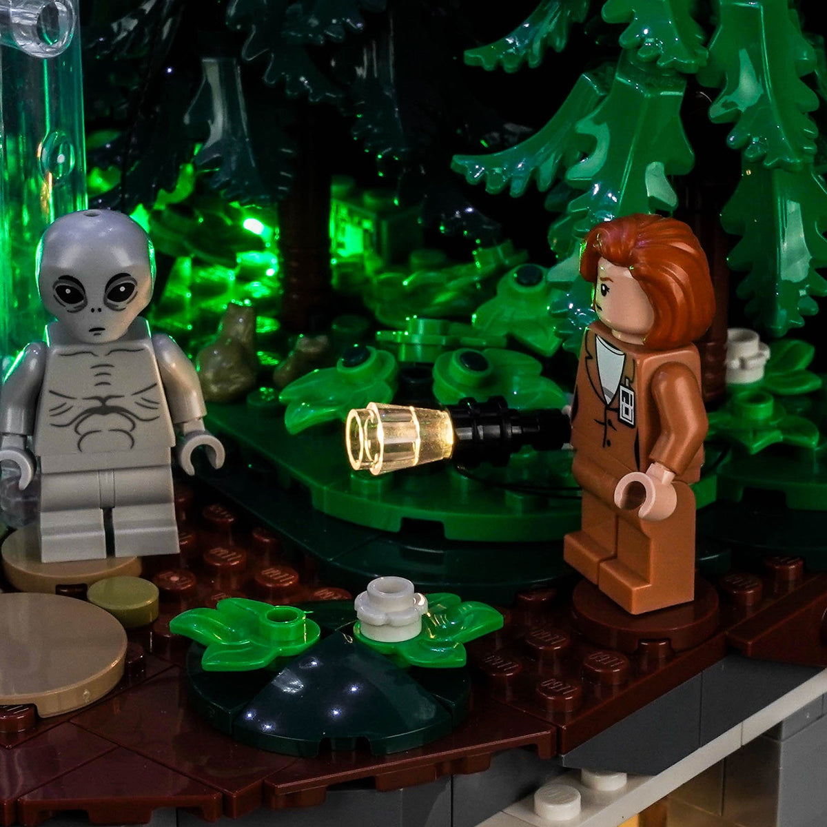 LEGO® Ideas The X-Files #21369 display lighting in a dark room, with the premium LED light kit