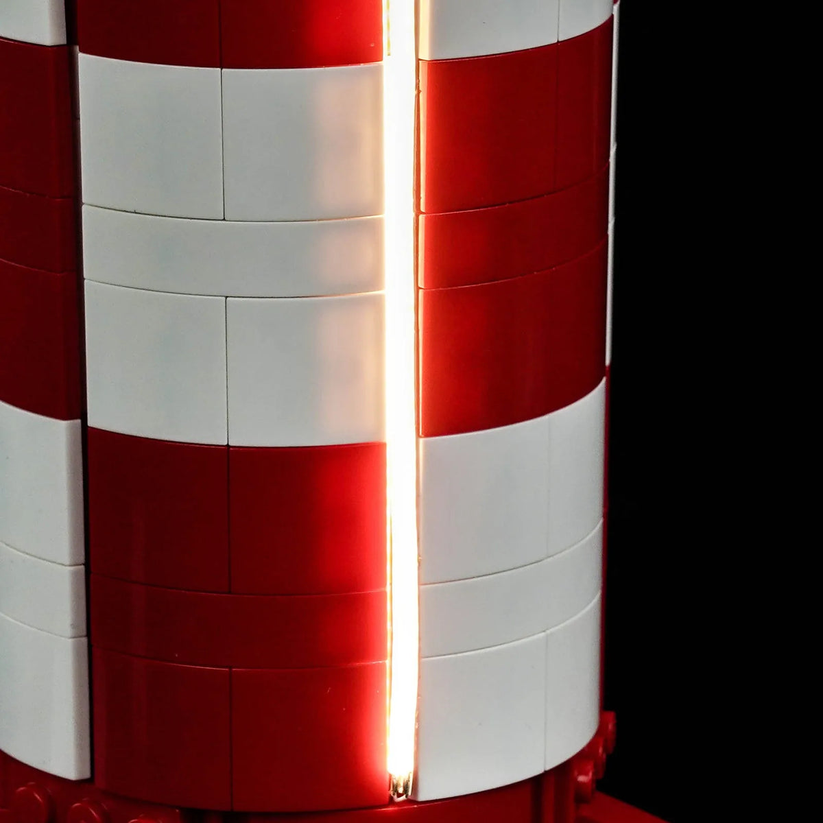 LEGO® Ideas Tintin Moon Rocket #21367 fully illuminated on display, with the USB-powered LED light kit
