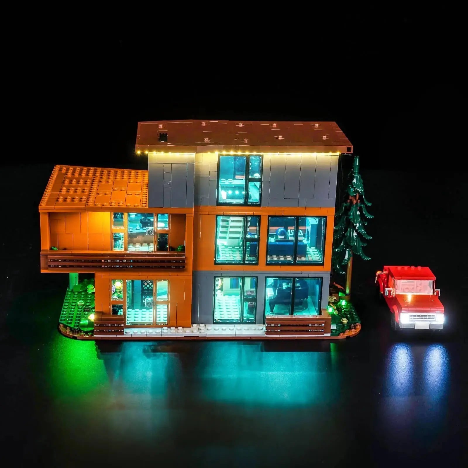 LEGO Ideas Twilight: The Cullen House #21354 illuminated at night