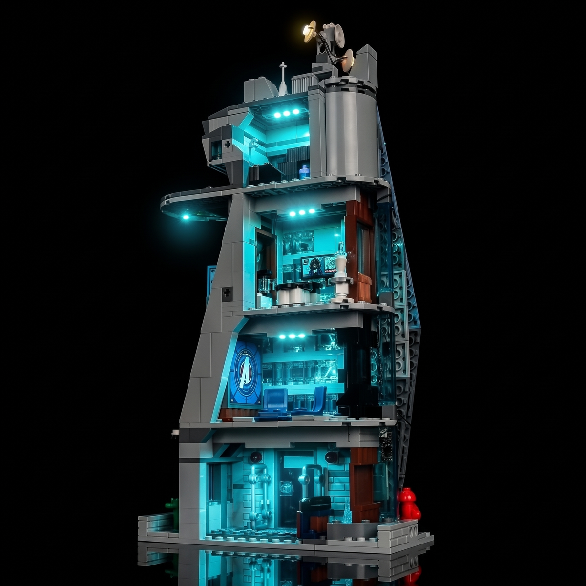 Rear interior of LEGO® New Avengers Tower #76352 with blue-lit rooms and warm rooftop details