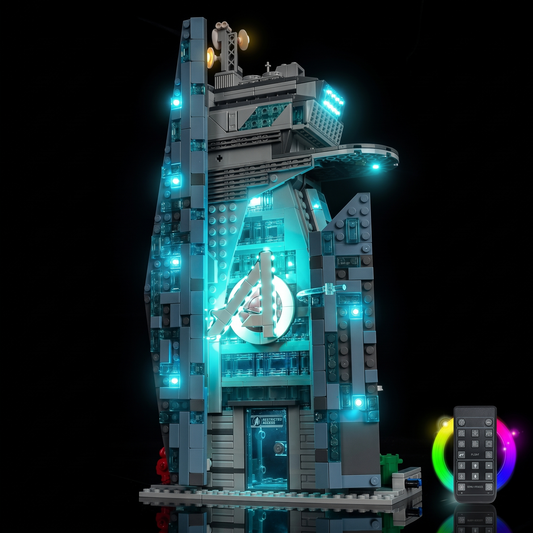 Remote control beside the illuminated LEGO® New Avengers Tower #76352 and its colour lighting effects