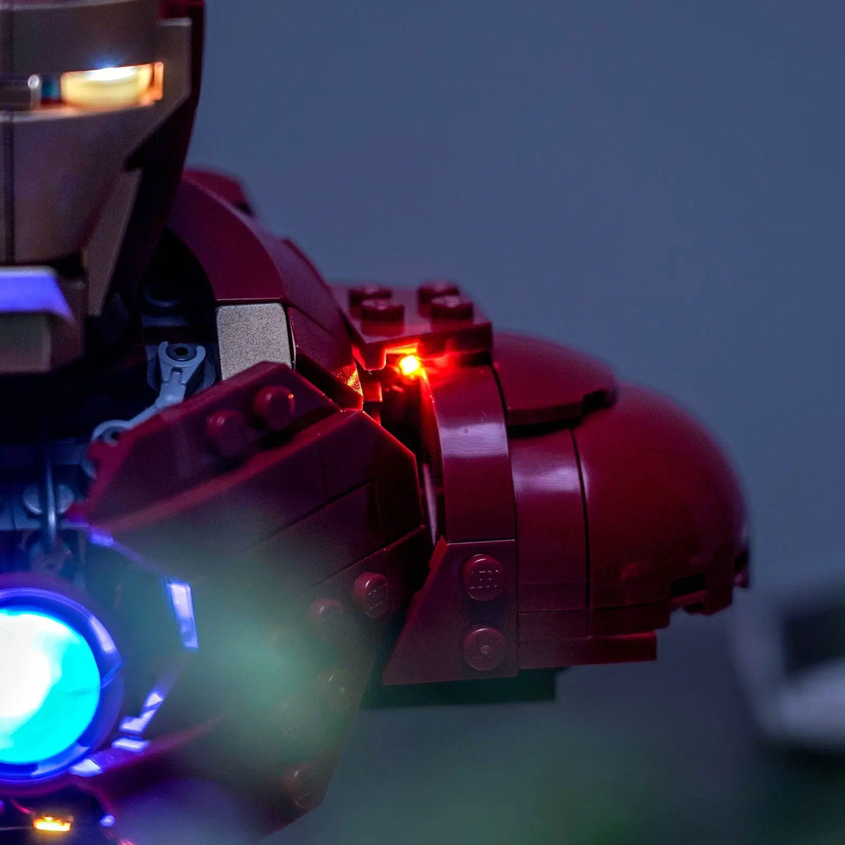 LEGO® Marvel Iron Man MK4 Bust #76327 fully illuminated on display, with the USB-powered LED light kit
