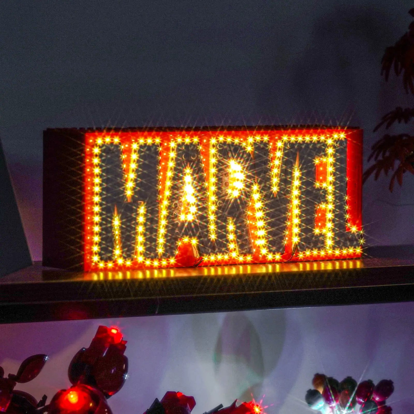 LEGO® Marvel MARVEL Logo & Minifigures #76313 — showcase lighting view (LED lighting kit)
