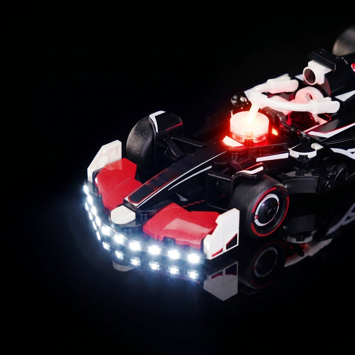 illuminated at night: Bright My Bricks RGB LED light kit for LEGO® MoneyGram Haas F1 Team VF-24 Race Car #77250