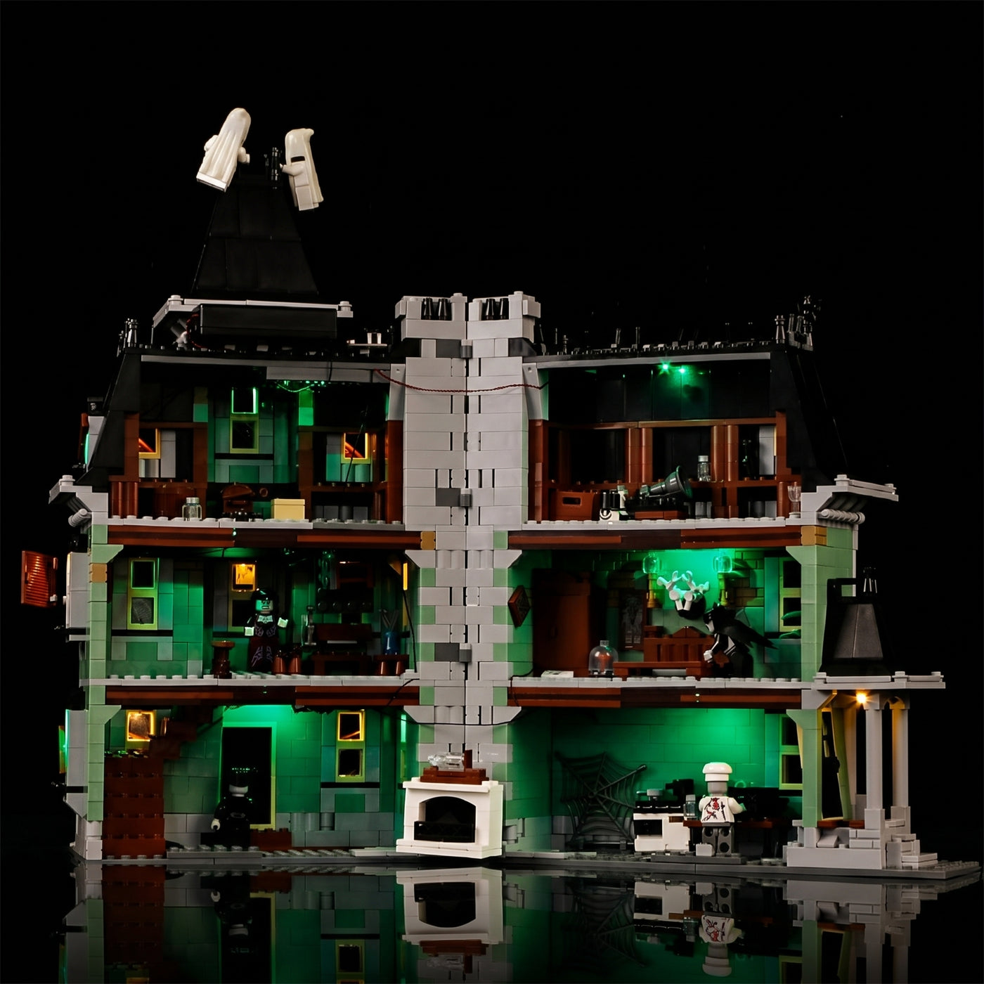 LEGO® Monster Fighters Haunted House #10228 illuminated at night, with the light kit