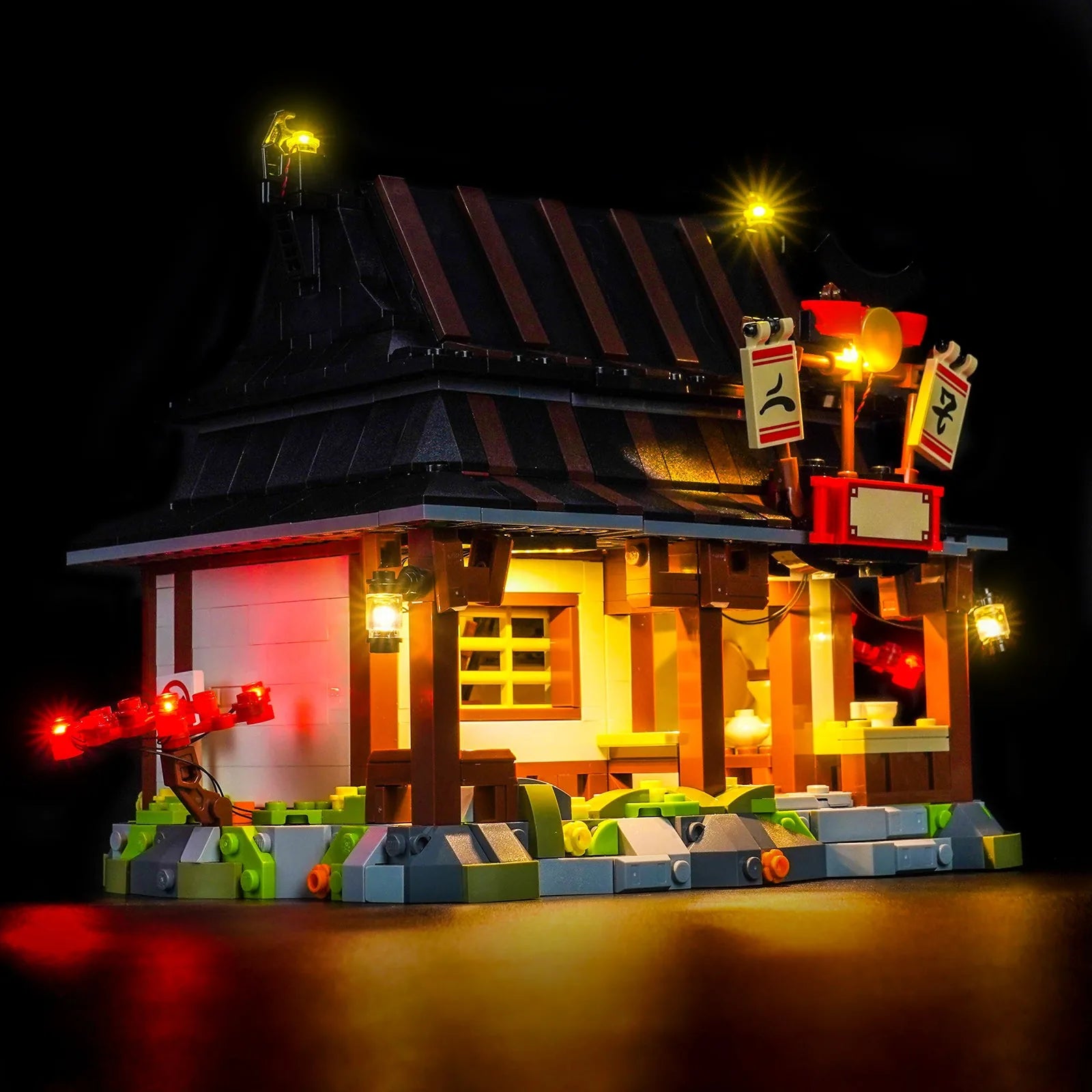 LEGO® Ninjago Four Weapons Blacksmith 15th Anniversary #71858 warm LED glow detail, with the DIY LED light kit