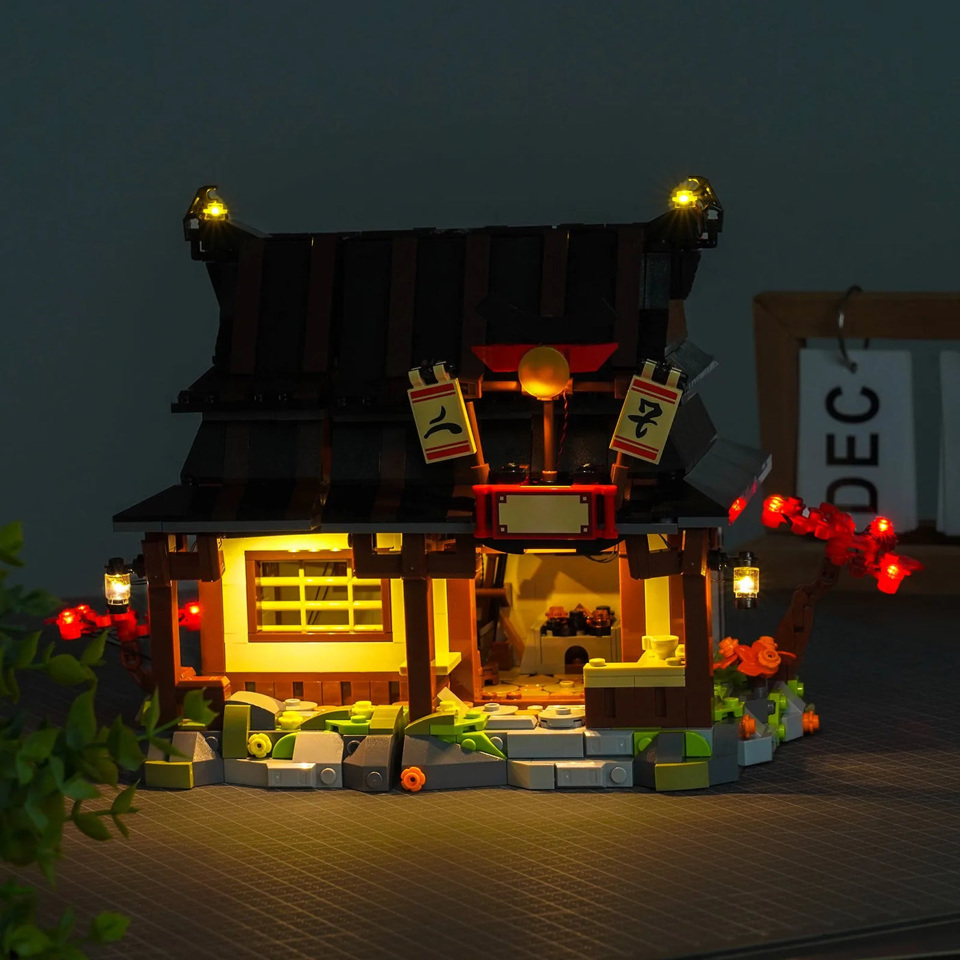 LEGO® Ninjago Four Weapons Blacksmith 15th Anniversary #71858 — illuminated at night (custom LED lighting)