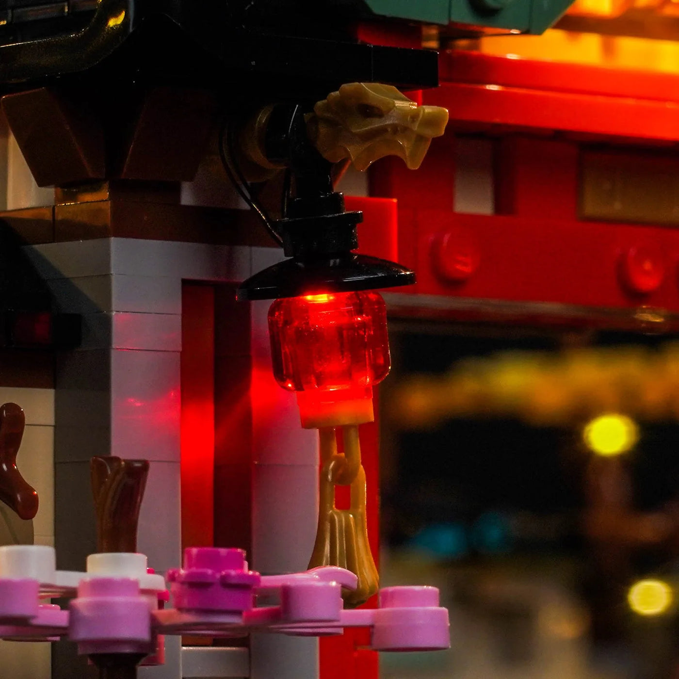 side angle with lights on: Bright My Bricks RGB LED light kit for LEGO® NINJAGO The Old Town 15th Anniversary #71861