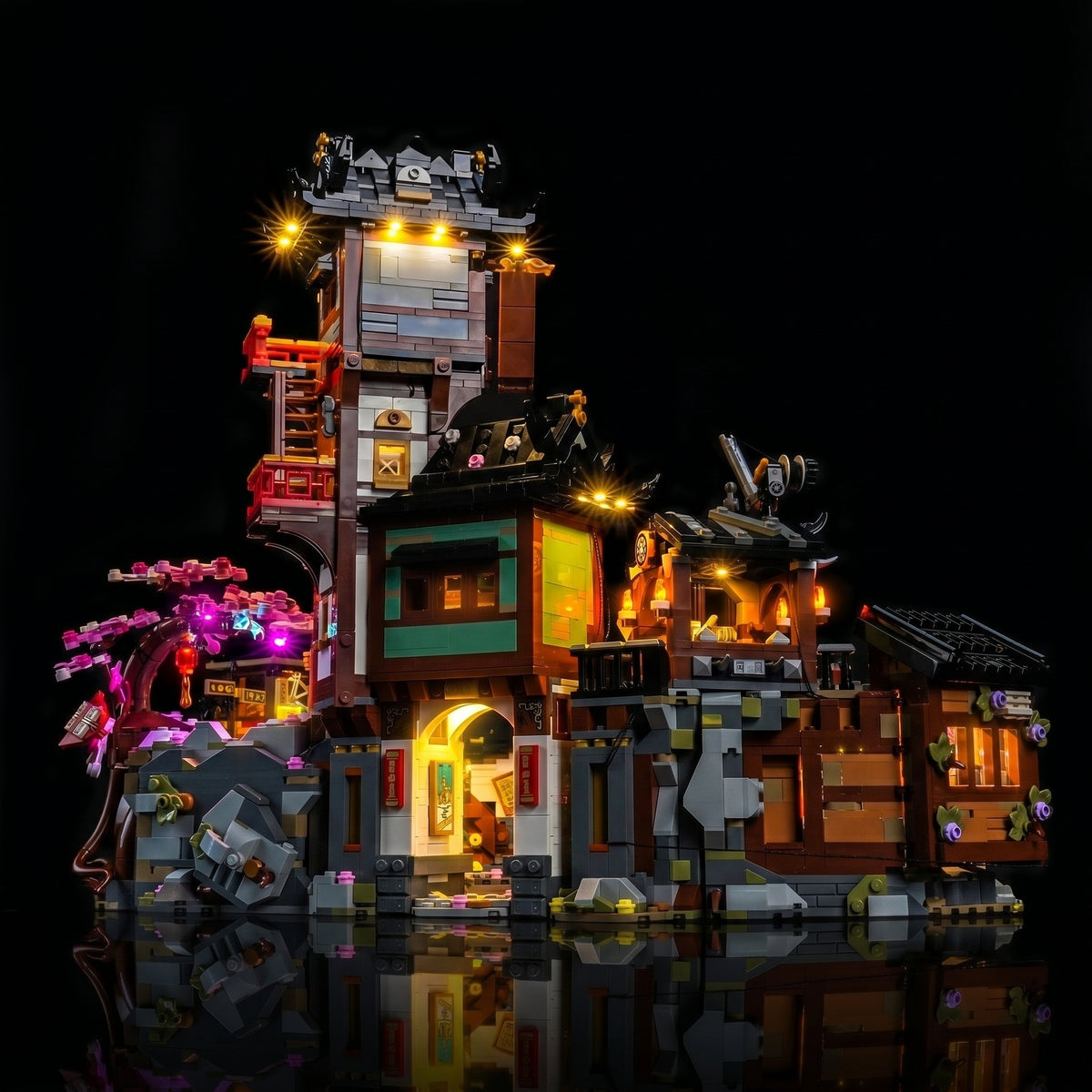 LEGO® NINJAGO The Old Town 15th Anniversary #71861 installed and glowing, with the USB-powered LED light kit