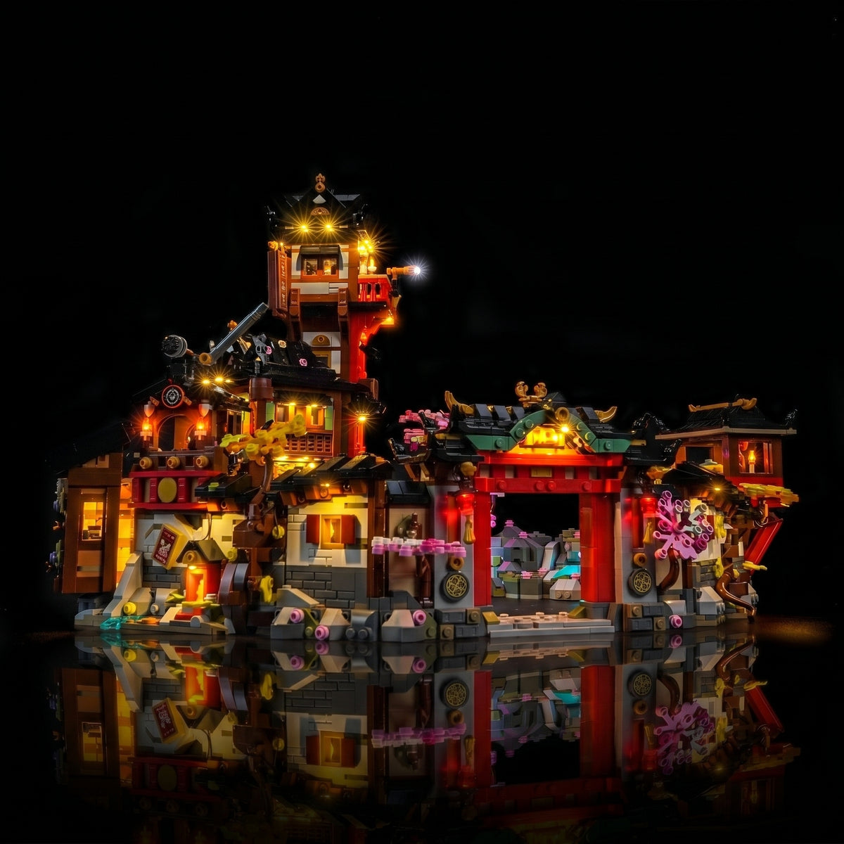 LEGO® NINJAGO The Old Town 15th Anniversary #71861 side angle with lights on, with the premium LED light kit
