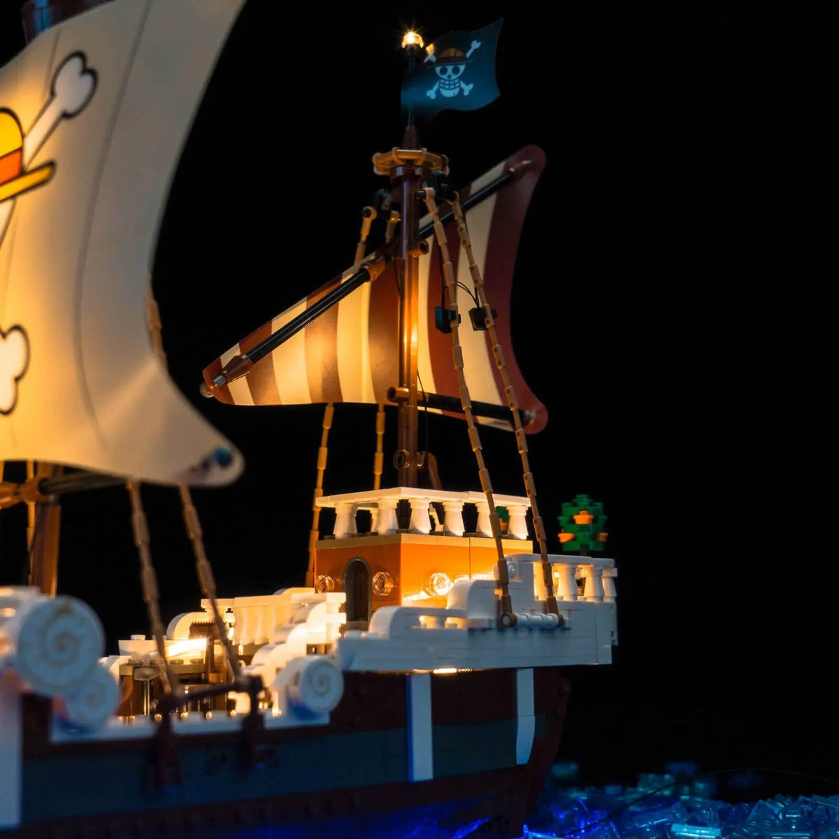 LEGO® One Piece The Going Merry Pirate Ship #75639 illuminated at night, with the custom LED lighting