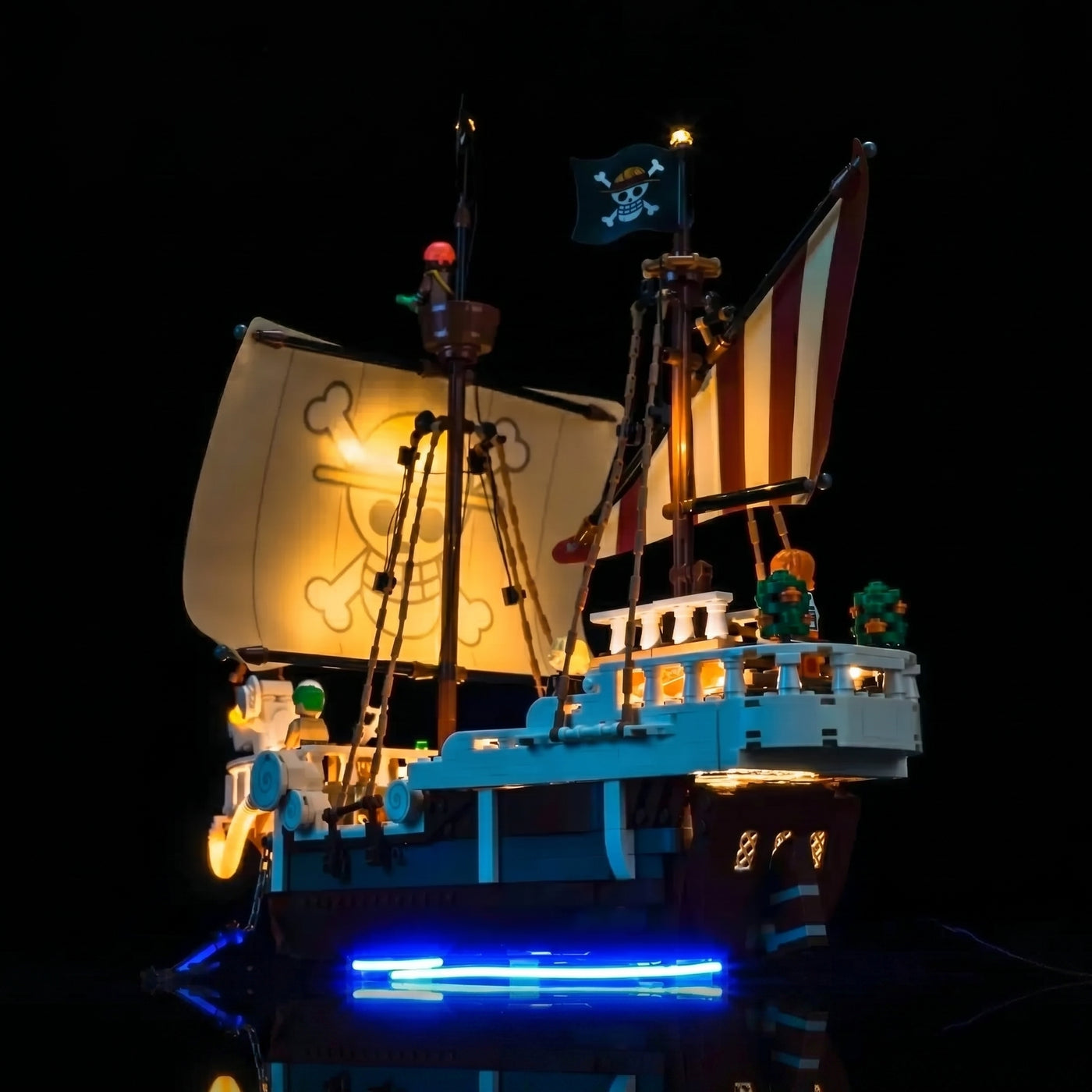 LEGO® One Piece The Going Merry Pirate Ship #75639 side angle with lights on, with the LED lights