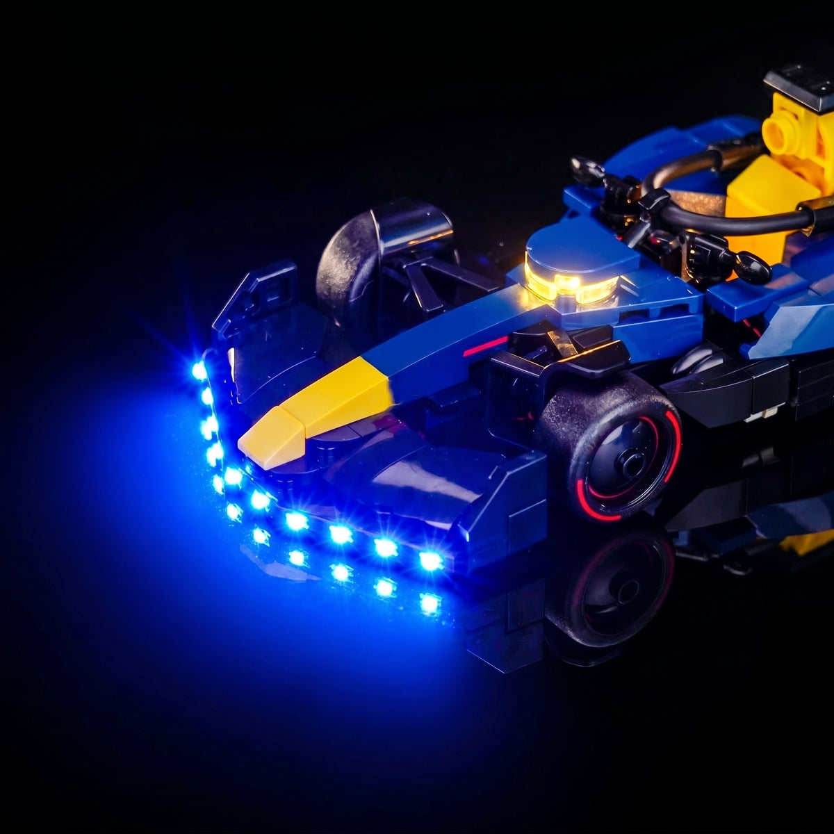 LEGO® Oracle Red Bull Racing RB20 F1 Race Car #77243 display lighting in a dark room, with the LED lighting kit