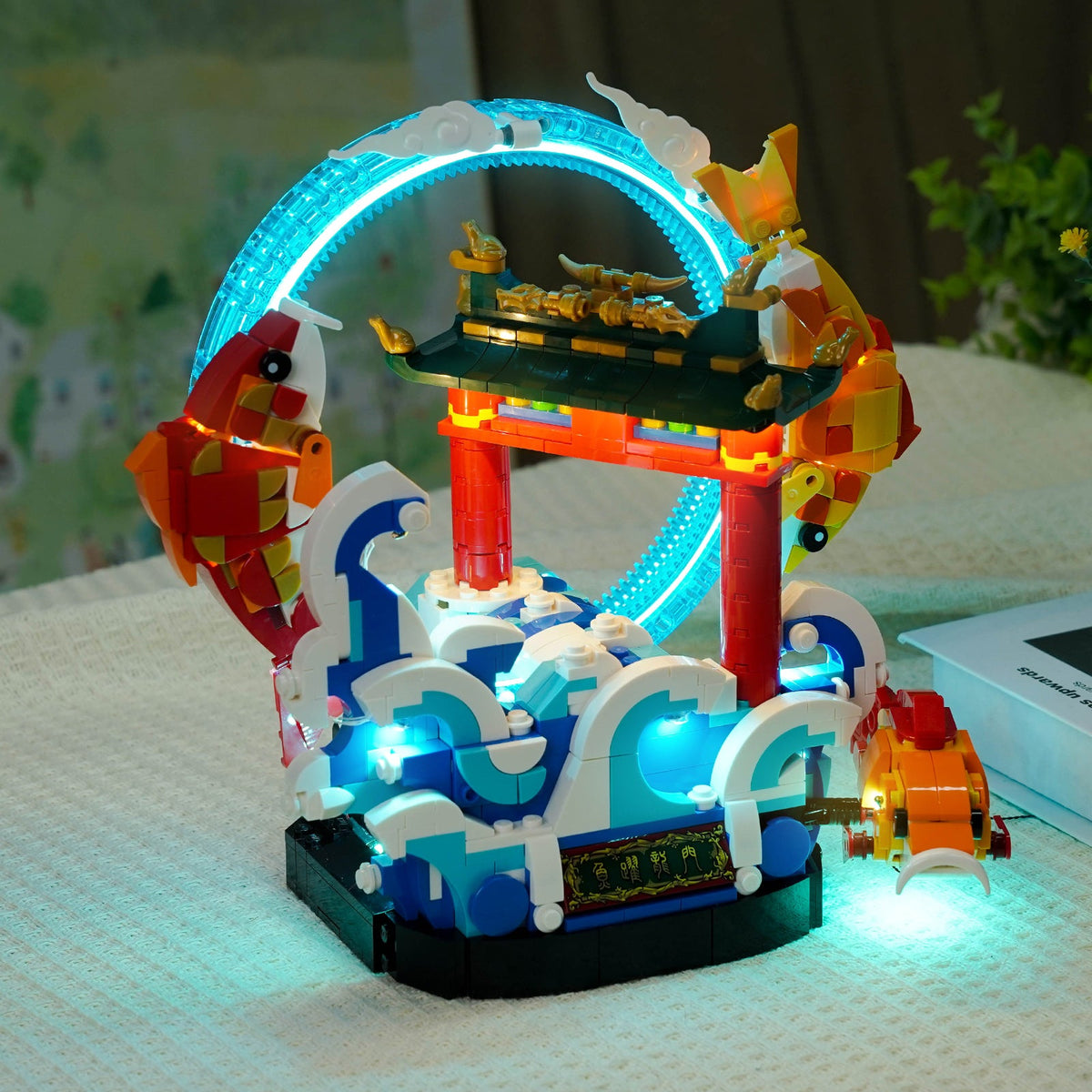 LEGO® Prosperity Carp Leaping #80120 — side angle with lights on (RGB LED light kit)