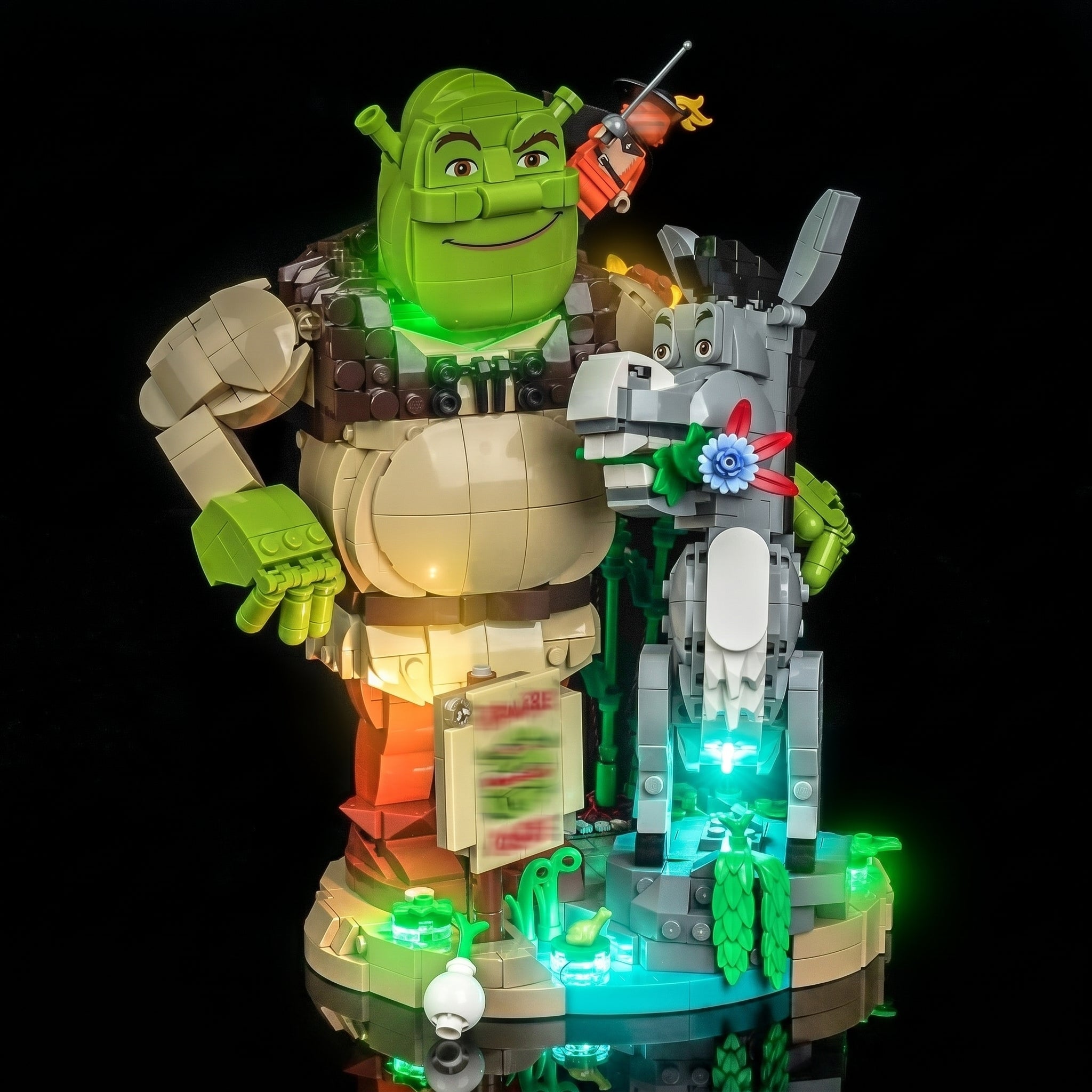 LEGO® Shrek, Donkey & Puss in Boots #72423 display lighting in a dark room, with the USB-powered LED light kit