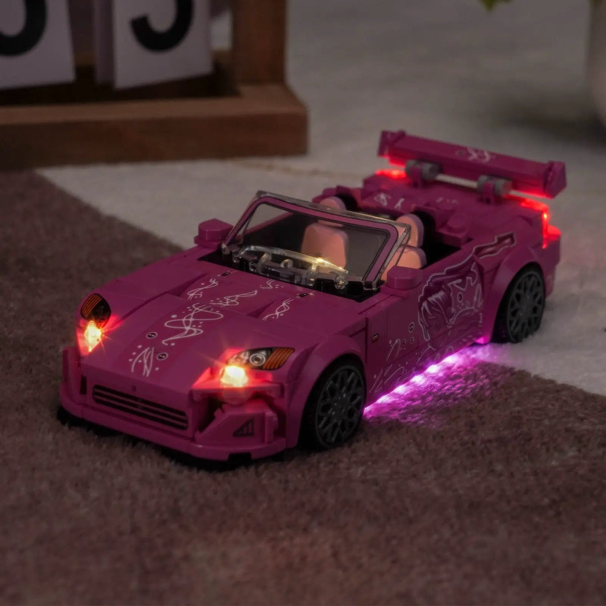 LEGO® Speed Champions 2 Fast 2 Furious Honda S2000 #77241 side angle with lights on, with the RGB LED light kit