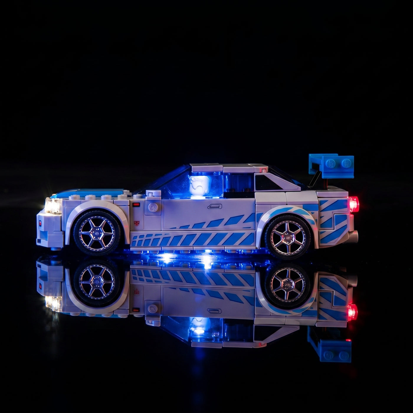 LEGO® Speed Champions 2 Fast 2 Furious Nissan Skyline GT-R (R34) #76917 installed and glowing, with the LED lights