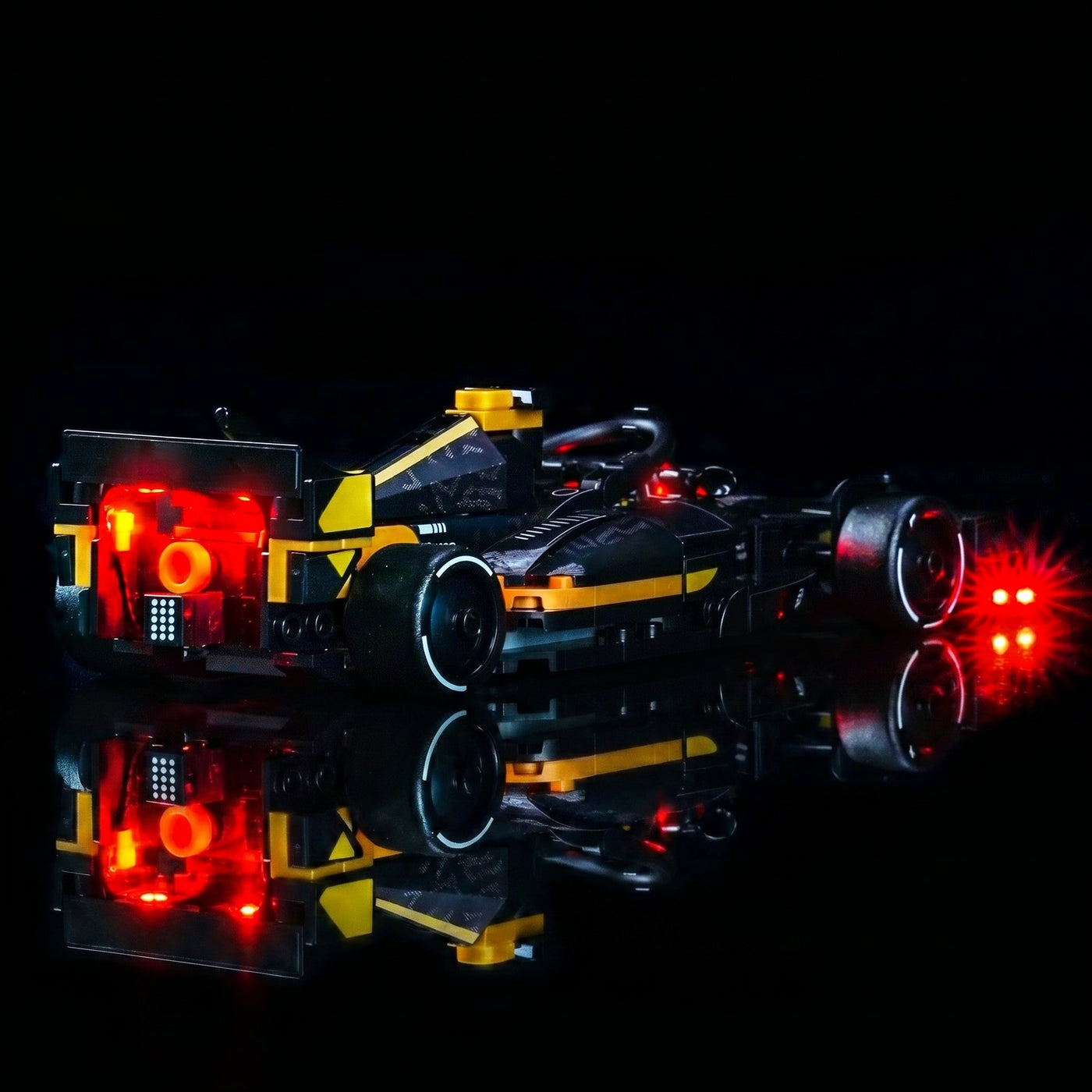 LEGO® Speed Champions APXGP Team Race Car from F1 The Movie #77252 front view fully lit, with the light kit
